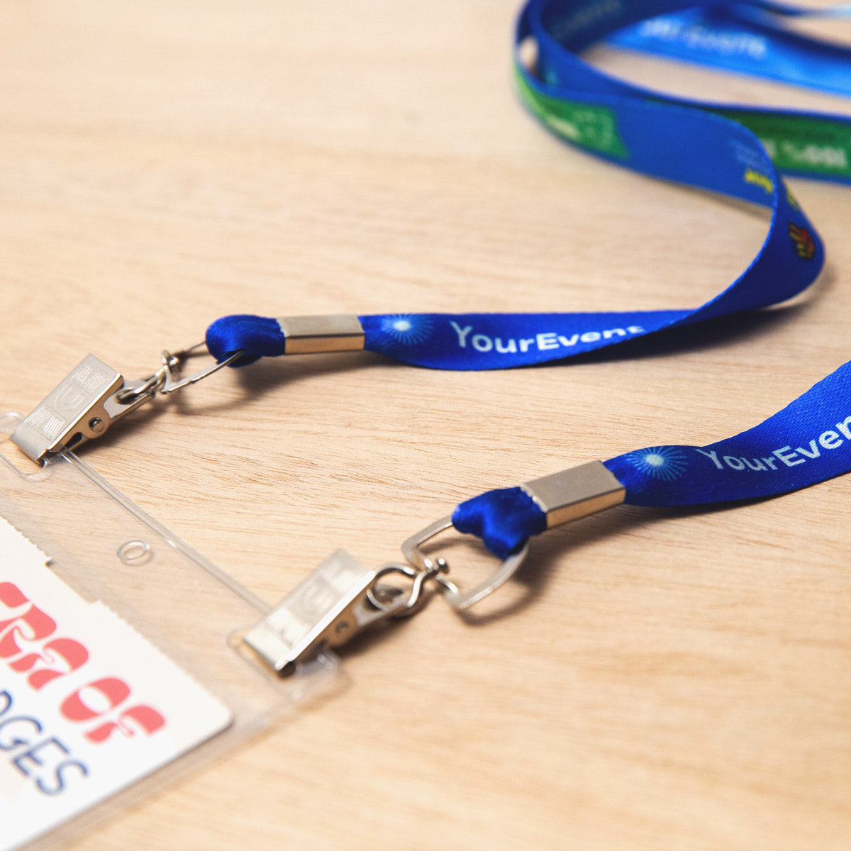 Elevate your brand with our personalized conference lanyards. Crafted from recycled bottles, our eco-friendly event lanyards feature a double bulldog clip attachment, offering durability and bringing your designs to life with stunning detail and clarity.