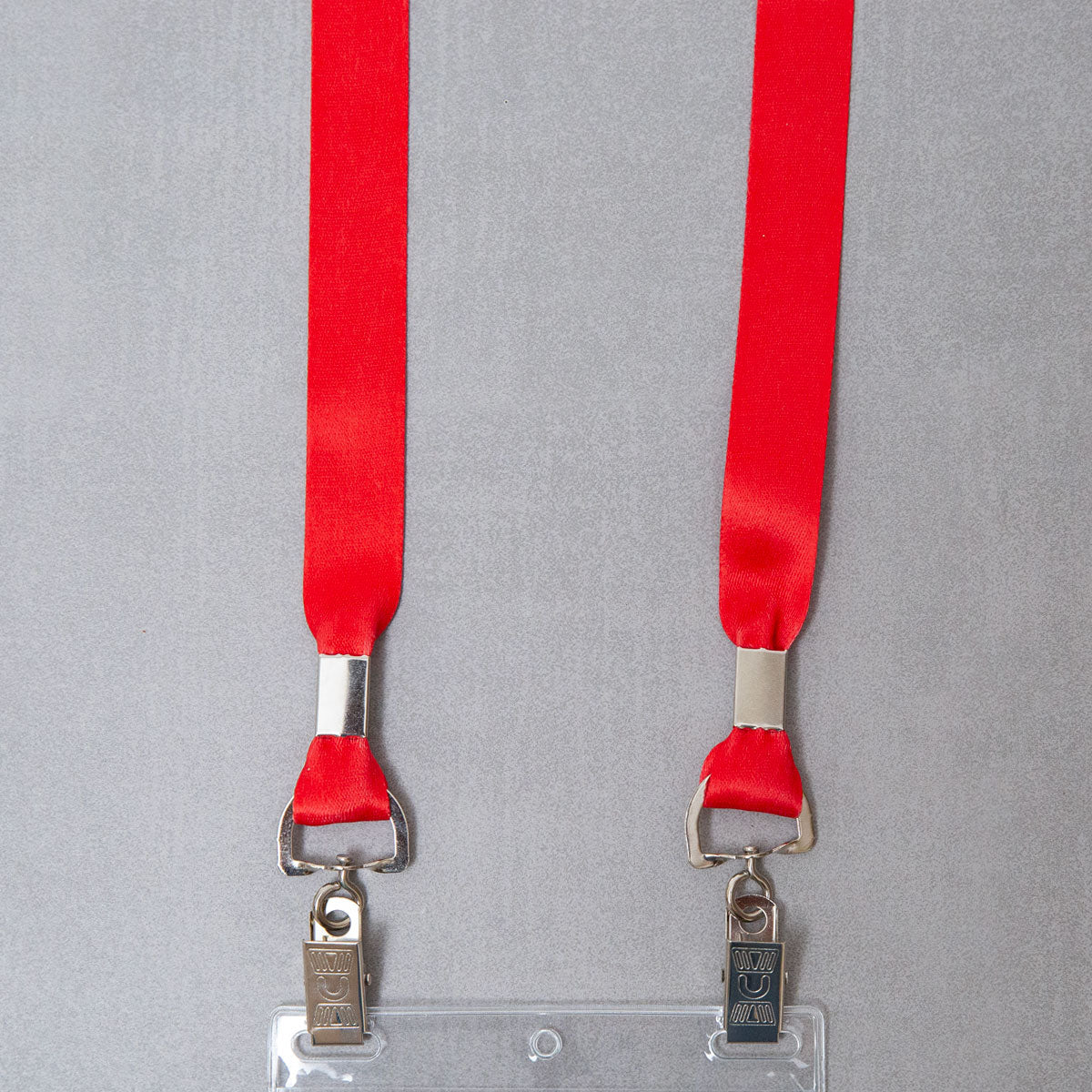 Elevate your brand with our premium red conference badge lanyards. Crafted for durability and featuring vibrant color and a double bulldog clip attachment, our event lanyards combine style and functionality to make a lasting impression.