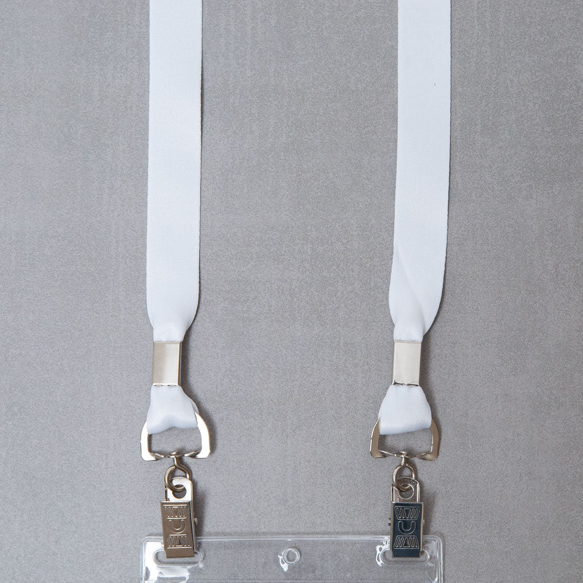 Elevate your brand with our premium white conference badge lanyards. Crafted for durability and featuring vibrant color and a double bulldog clip attachment, our event lanyards combine style and functionality to make a lasting impression.